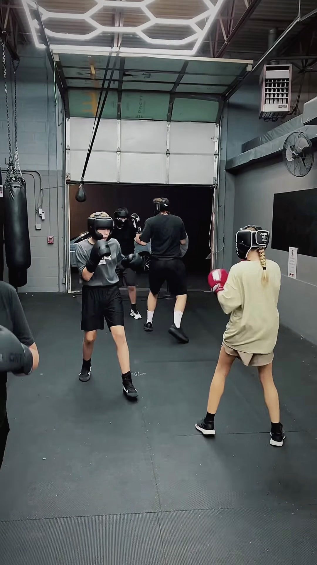 Group sparring session on the gym floor